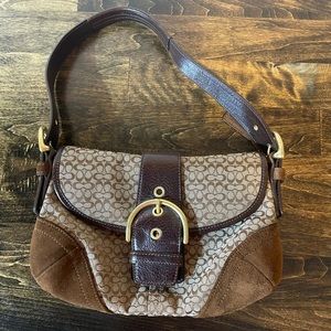 Coach shoulder bag. Browns, tans, neutral tones.